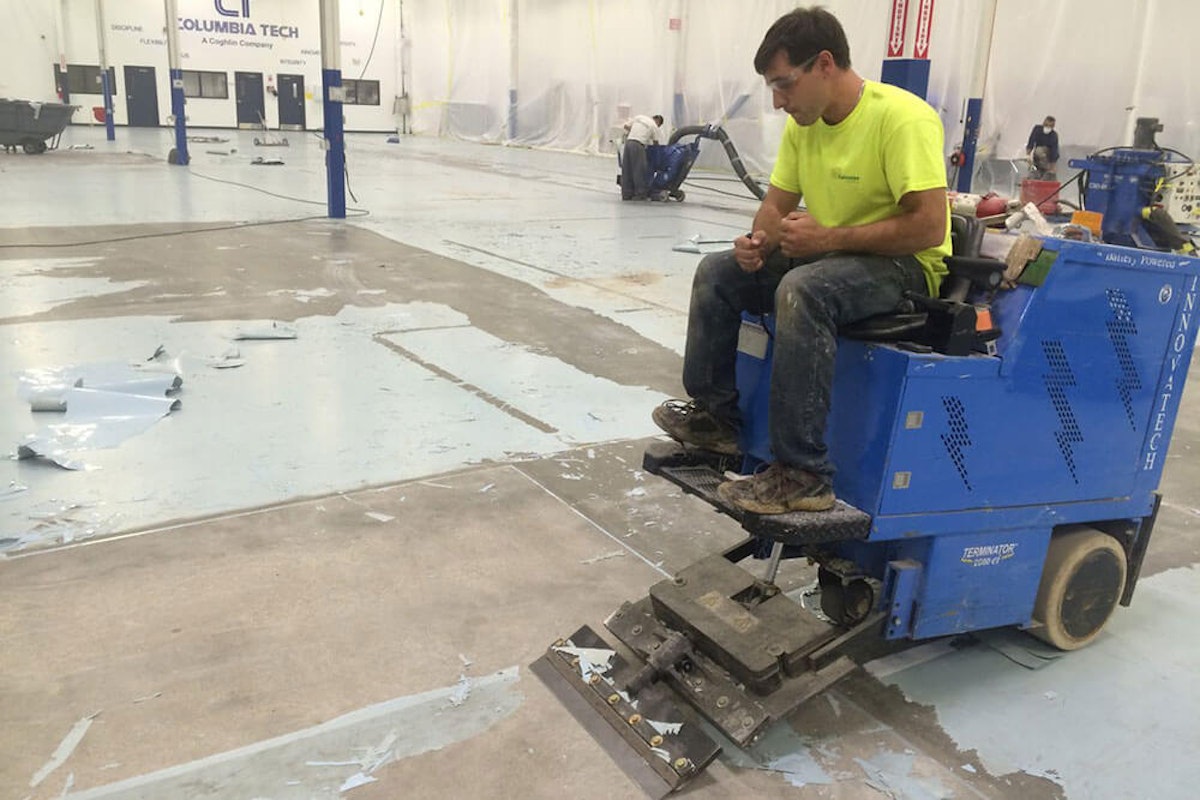 Kaloutas contractor repairing industrial floor Here are the Top 6 Must-Haves to Solve Your Industrial Flooring Problems
