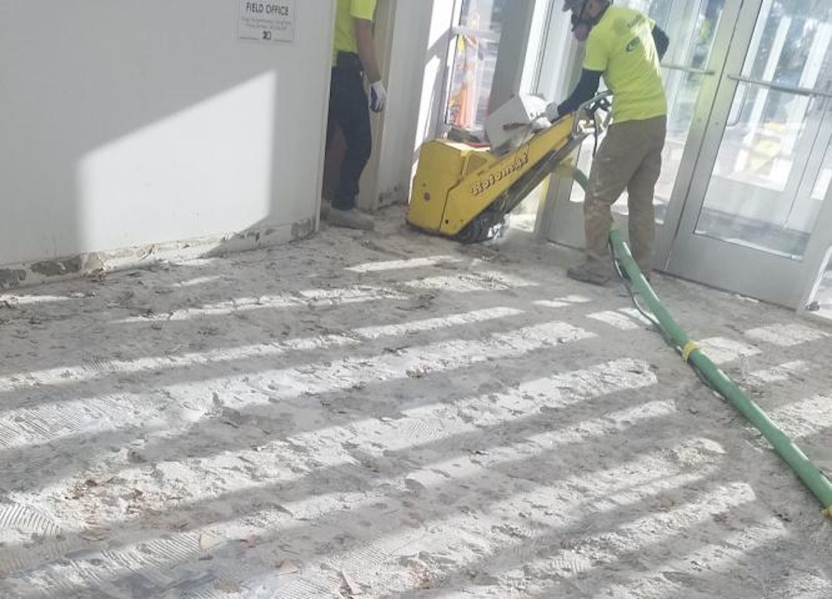 Kaloutas employee performing industrial flooring services while adhering to OSHA Silica Standard Have You Heard About the New OSHA Silica Standard? How Is Your Contractor Protecting You?