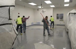Kaloutas contractors preparing for epoxy coating 3 Steps for Planning Your Epoxy Floor Coating for a High-Traffic Commercial Floor