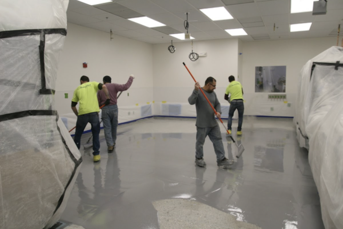 Kaloutas contractors preparing for epoxy coating 3 Steps for Planning Your Epoxy Floor Coating for a High-Traffic Commercial Floor