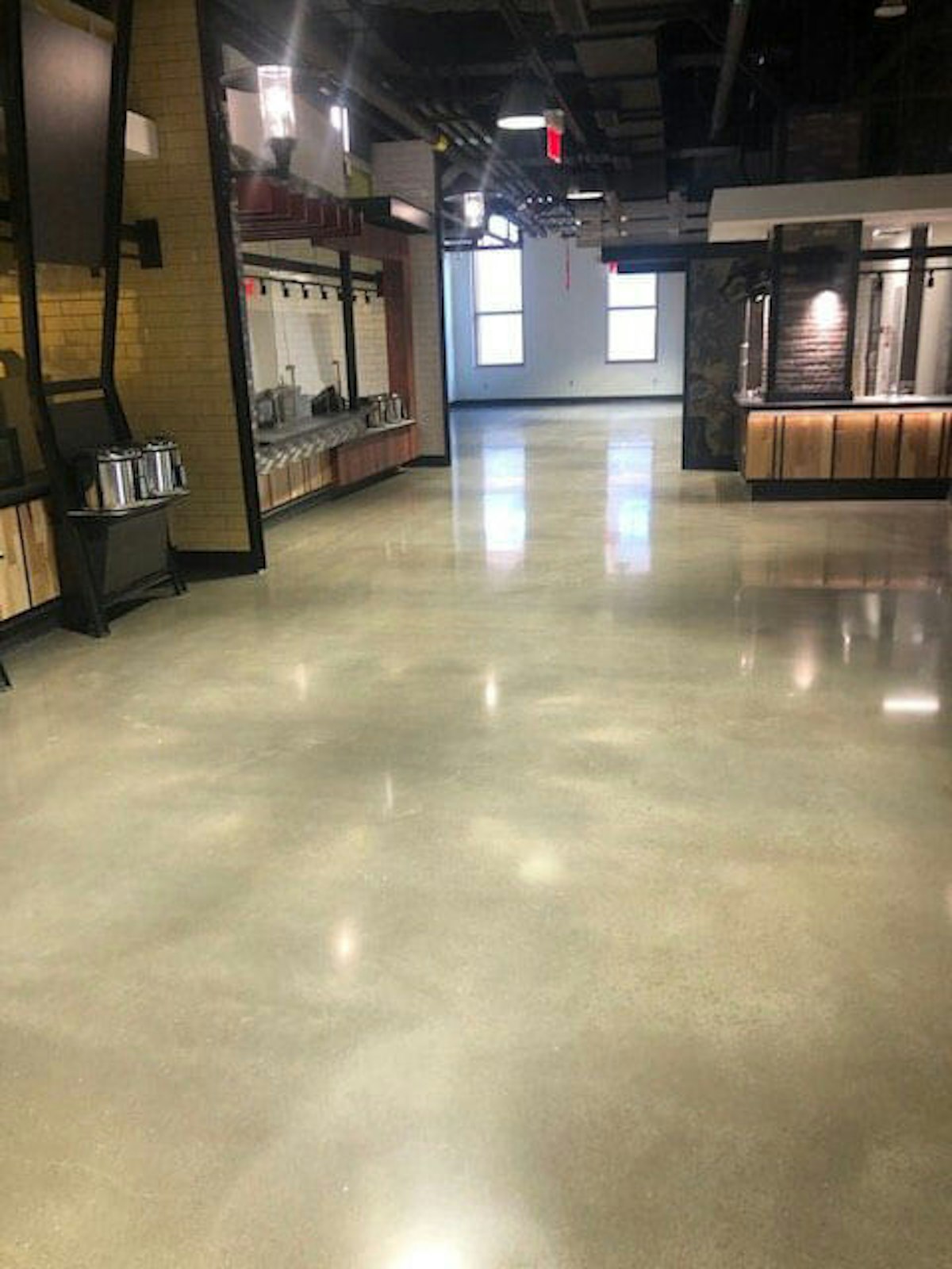 Polished concrete floor in a facility 3 Ways Polished Concrete Flooring Adds to Proactive Facility Maintenance