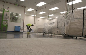 Employee working on anti-static flooring in an industrial building. Don't Be Shocked by These Anti-Static Flooring Facts
