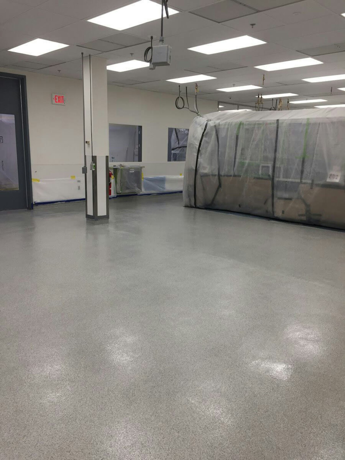 Polished concrete floor in a facility How to Maintain Polished and Epoxy Concrete Flooring
