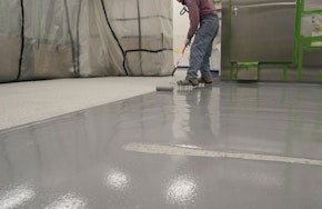 Man polishing a facility floor. How Updated Facility Flooring Benefits All Occupants at Your Industrial Facility