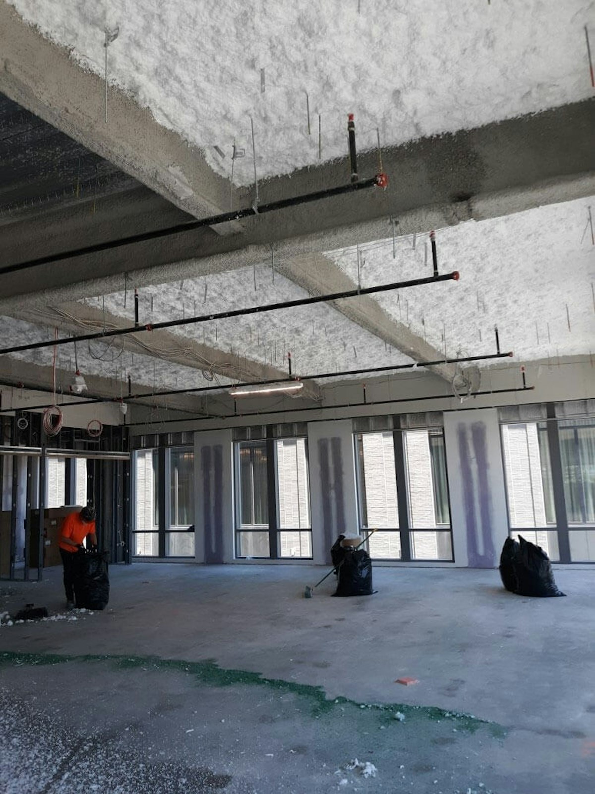 Ther­mal-acousti­cal insulation in a building being renovated. How Ther­mal-Acousti­cal Insulation Protects and Upgrades Your Multi-Use Facility