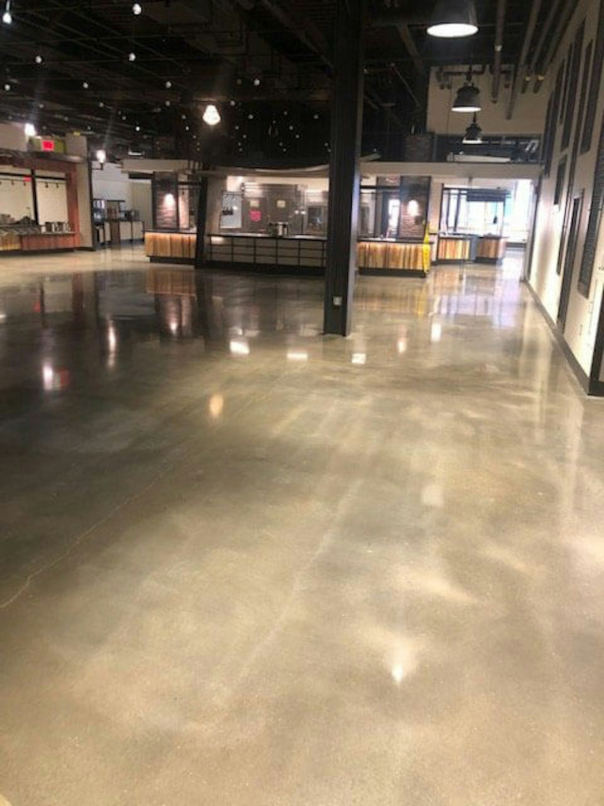 Newly polished concrete floor in a building. What Concrete Polishing Contractors Can Do to Save Your Warehouse
