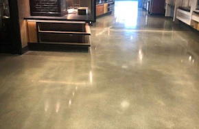 Interior floor with concrete polishing What Dust Proofing Your Floors with Concrete Polishing Adds to Your Facility Maintenance